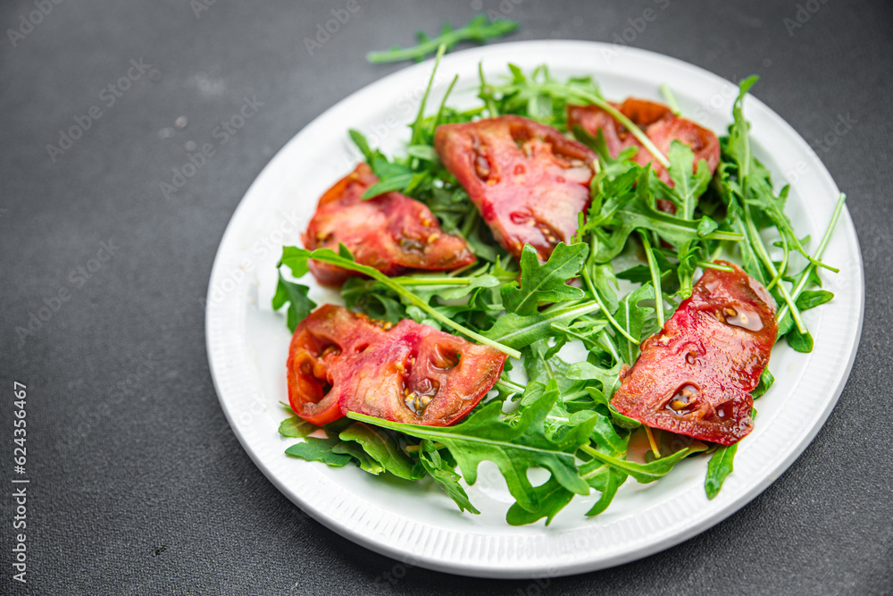 red tomato salad arugula healthy meal food snack on the table copy space food background rustic top view 