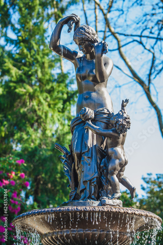 fountain with statue  of woman with an amur