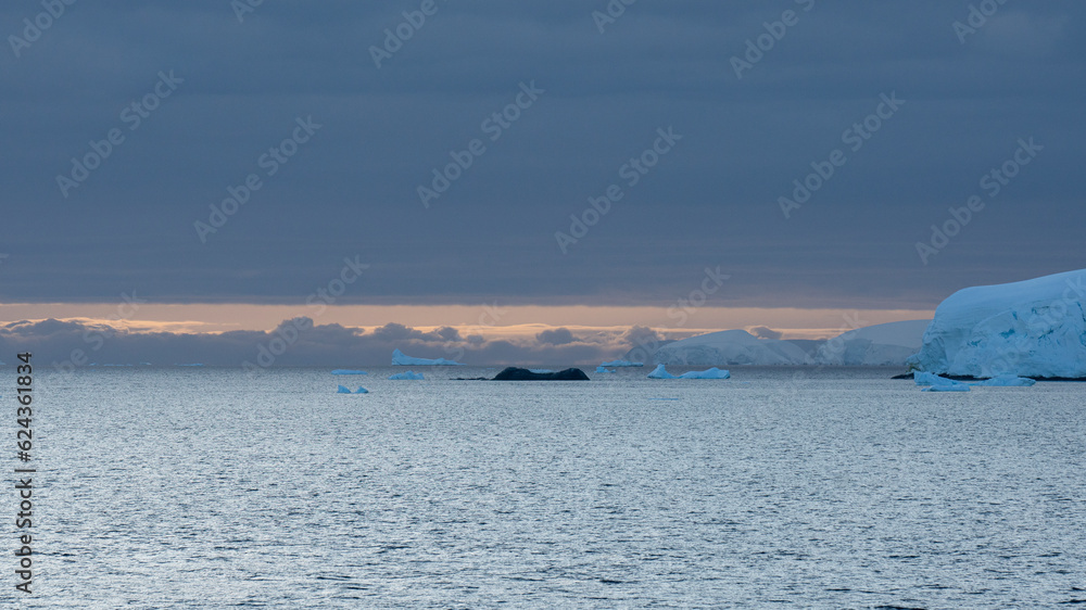 Evening view of the mountains of the Antarctic with the last rays of the sun