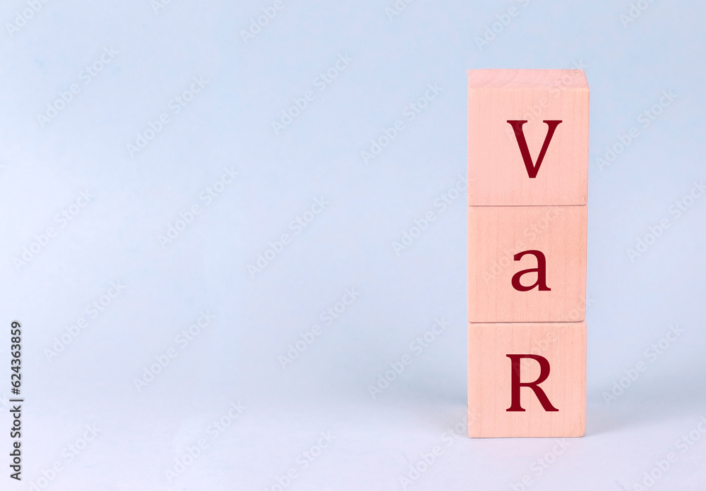 VAR on wooden cubes on a blue background VAR on wooden cubes on a blue background