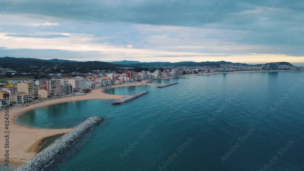 Aerial view of Palamos city at dusk during summer along Costa Brava Catalonia Aerial view of Palamos city at dusk during summer along Costa Brava Catalonia
