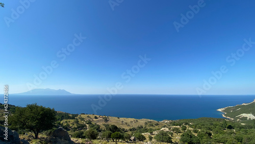 Gokceada (Imbros) coastline seashore view with Samothrace Greek island at background. Tepeköy village, Çınaraltı-Pinarbasi location, Aegean Turkey