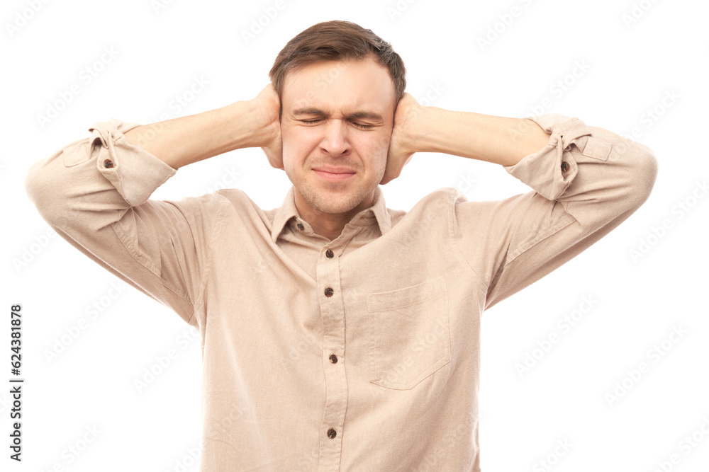 Portrait of nervous young man covering ears with hands isolated on white background. Stress, emotional burnout, self-doubt concept Portrait of nervous young man covering ears with hands isolated on white background. Stress, emotional burnout, self-doubt concept