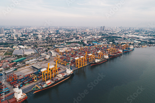 Aerial view shipping crane boat city habour port with container truck city view background © themorningglory