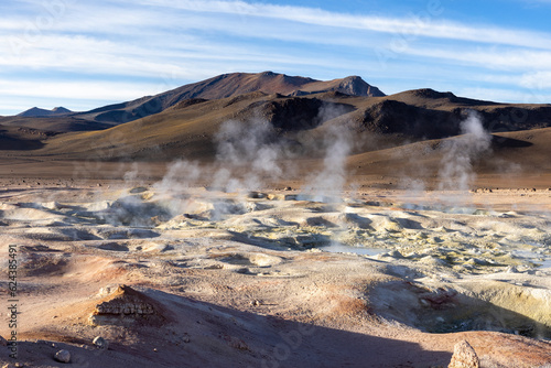 Stunning geothermic field of Sol de Mañana with its steaming geysers and hot pools with bubbling mud - just one sight on the lagoon route in Bolivia, South America 