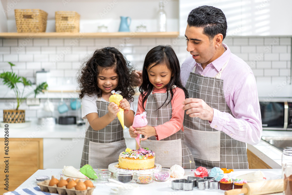 Portrait of enjoy happy love asian family father and little toddler asian girl daughter child having fun cooking together with dough for homemade bake cookie and cake ingredient on table in kitchen
