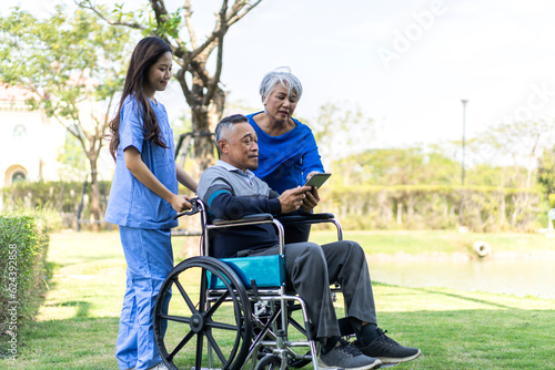 Portrait of smiling caring asian nurse service help support discussing and consulting taking care with senior elderly asian man and woman couple at home visit.senior retirement home care concept