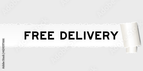 Ripped gray paper background that have word free delivery under torn part