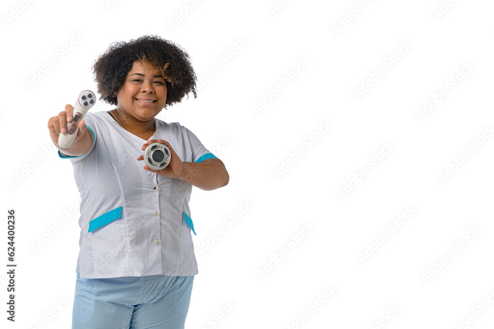 young Afro-Latin woman therapist standing smiling showing her facial cleansing tool white background young Afro-Latin woman therapist standing smiling showing her facial cleansing tool white background