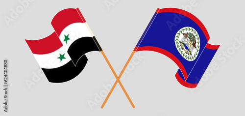 Crossed and waving flags of Syria and Belize