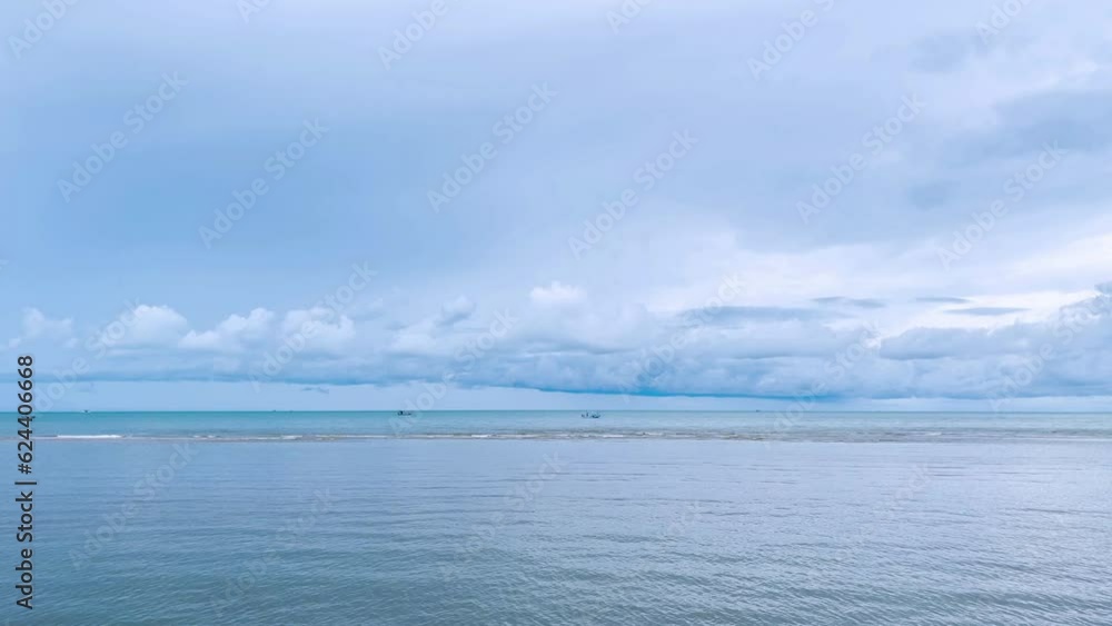 Sea waves and bright daytime sky with fishing boats Sea waves and bright daytime sky with fishing boats