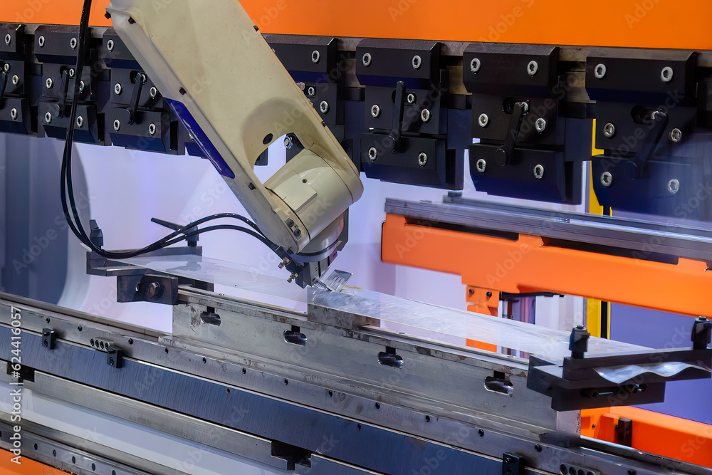 Close up the sheet metal bending process by robotic arm.