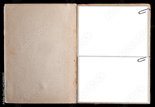 A vintage book page with blank photo frames attached with paper clips.