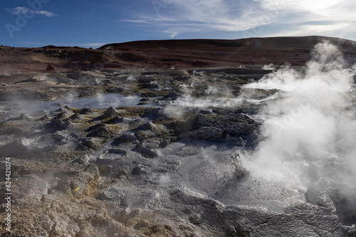 Stunning geothermic field of Sol de Mañana with its steaming geysers and hot pools with bubbling mud - just one sight on the lagoon route in Bolivia, South America © freedom_wanted