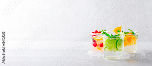 Summer Drinks Set, Fruit, Citrus and Berry Refreshing Lemonade or Cocktails on Bright Background