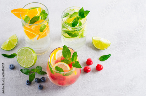 Summer Drinks Set, Fruit, Citrus and Berry Refreshing Lemonade or Cocktails on Bright Background