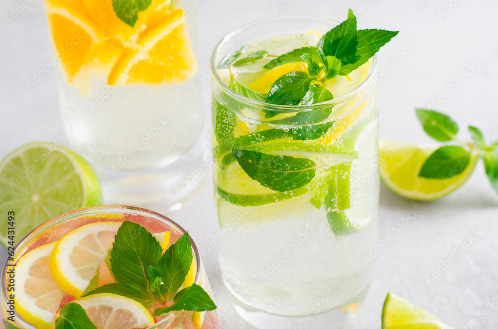 Fototapeta premium Summer Drinks Set, Fruit, Citrus and Berry Refreshing Lemonade or Cocktails on Bright Background