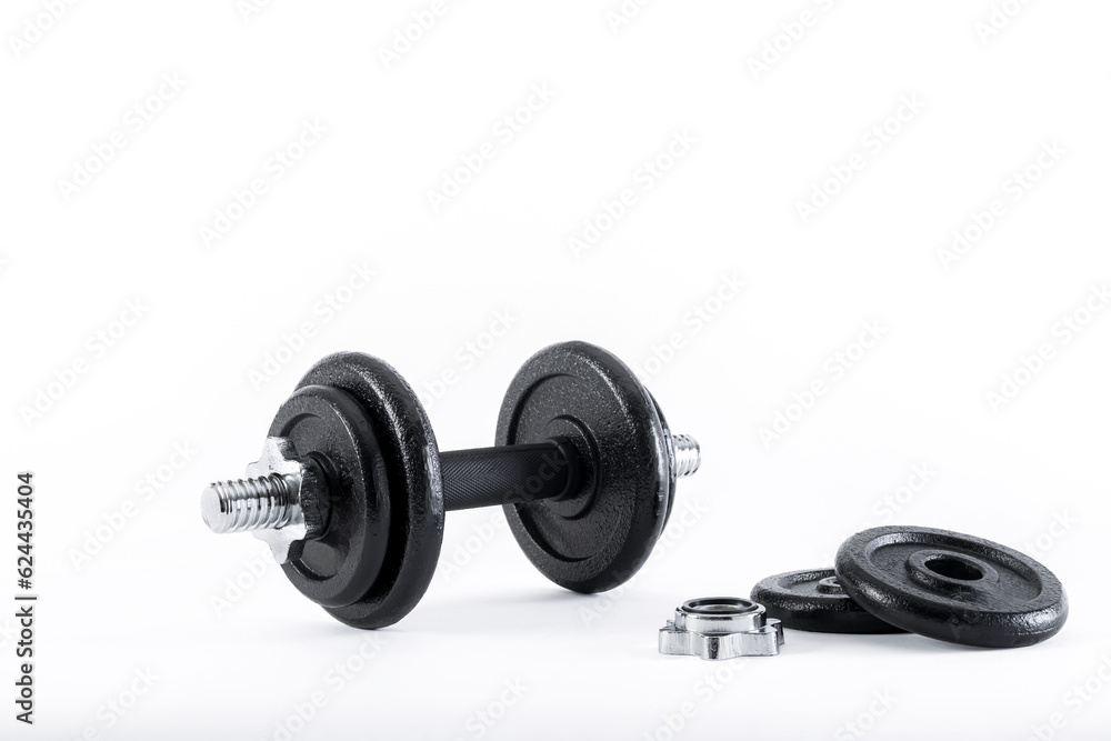 dumbbell and metal weights isolated on white background. dumbbell and metal weights isolated on white background.