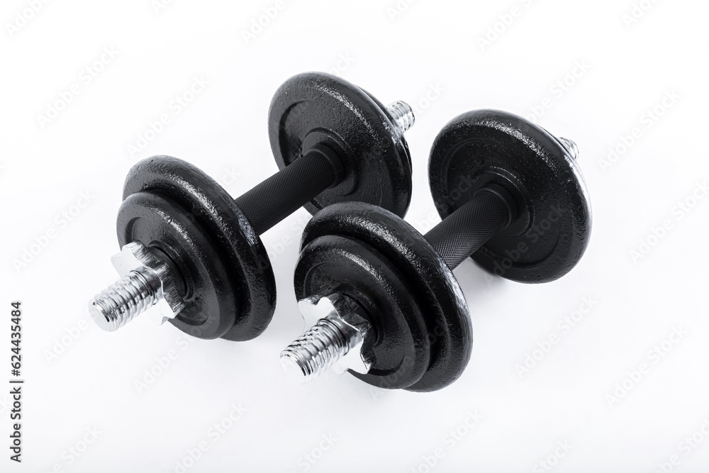 Fototapeta premium dumbbell and metal weights isolated on white background.