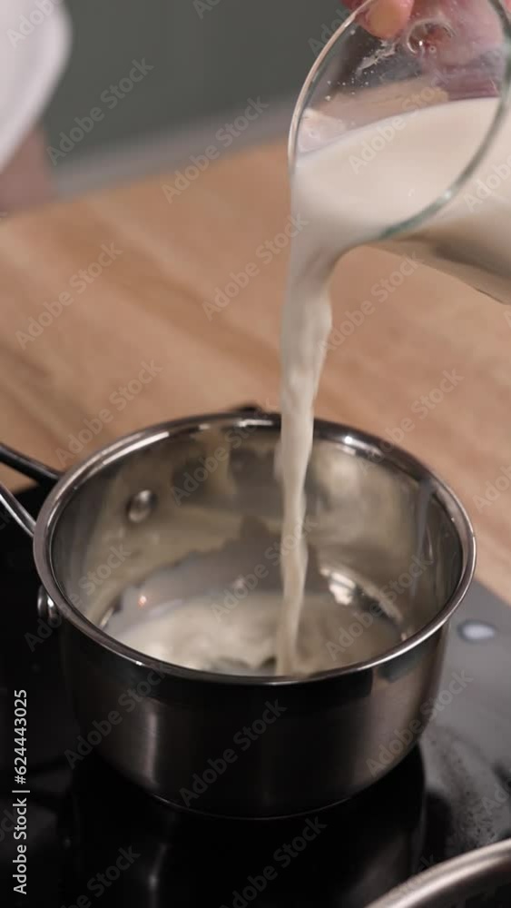 The chef is preparing milk. Close-up The chef is preparing milk. Close-up