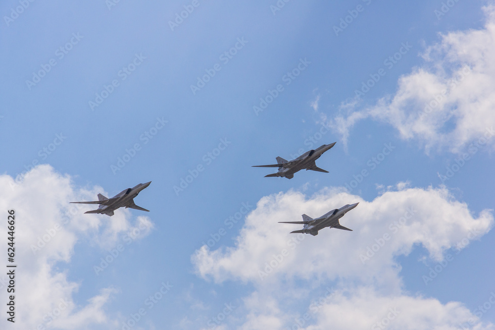 Long-range supersonic bombers-missile carriers in the sky. Three Tu-22M3 aircraft (NATO - Backfire) perform demonstration flight. 100 years of Russian Air Force. Zhukovsky, Russia, August 12, 2012 Long-range supersonic bombers-missile carriers in the sky. Three Tu-22M3 aircraft (NATO - Backfire) perform demonstration flight. 100 years of Russian Air Force. Zhukovsky, Russia, August 12, 2012