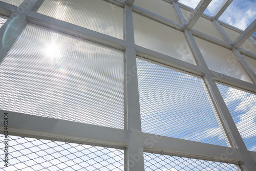 The use of expanded metal   tear steel grilles  to be installed on the exterior structure of the building instead of using glass to allow natural air to circulate and see the sky outside the building.