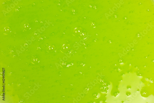 Green slime toy as a background.