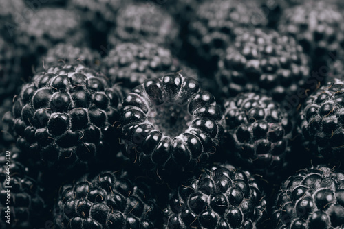 Black raspberries closeup. Macro shot. Heap of fresh ripe and sweet raspberries. 