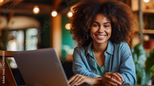 Young african american woman sitting in a coffee shop and working on laptop. Generative AI