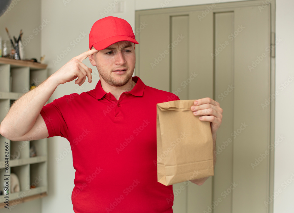 looking surprised, realizing a new thought, idea or concept. delivery paper bag concept looking surprised, realizing a new thought, idea or concept. delivery paper bag concept