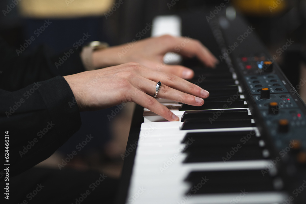 Obraz premium close-up of a pianist's hands while playing the piano