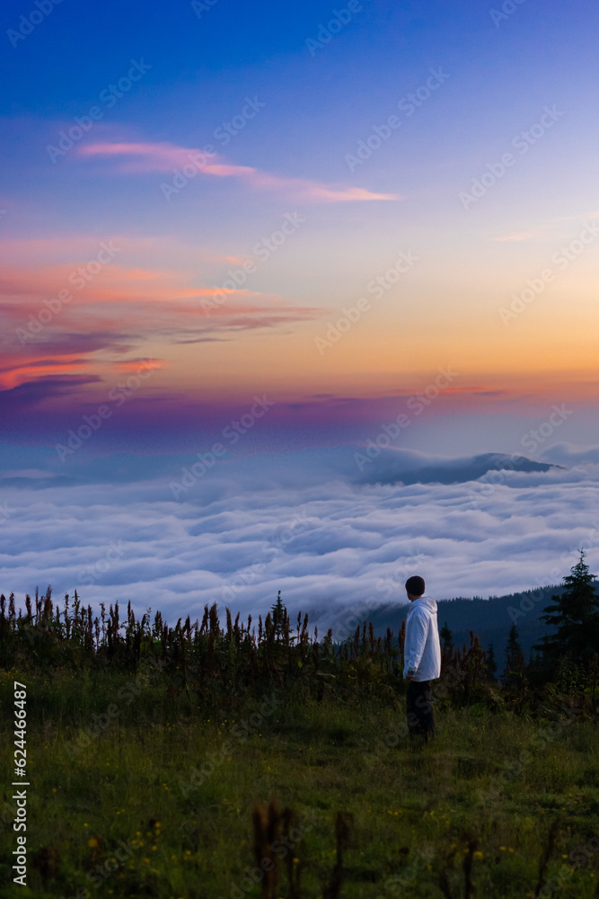 landscape in the mountains, sunset, sunrise, a man looks at the horizon, conquering the peaks, tourist, hiking, silhouettes of peaks, Montenegrin mountain range, Carpathians, travel, screensaver