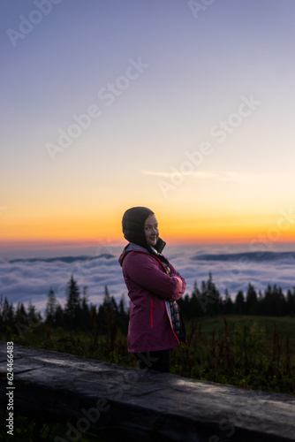 landscape in the mountains, sunset, sunrise, a girl looks at the horizon, conquering the peaks, tourist, hiking, silhouettes of peaks, Montenegrin mountain range, Carpathians, travel, screensaver © Hordina Anastasia 