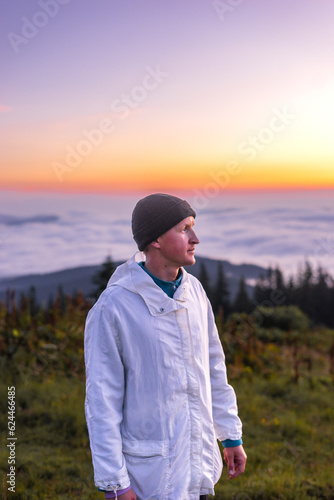 landscape in the mountains, sunset, sunrise, a man looks at the horizon, conquering the peaks, tourist, hiking, silhouettes of peaks, Montenegrin mountain range, Carpathians, travel, screensaver © Hordina Anastasia 