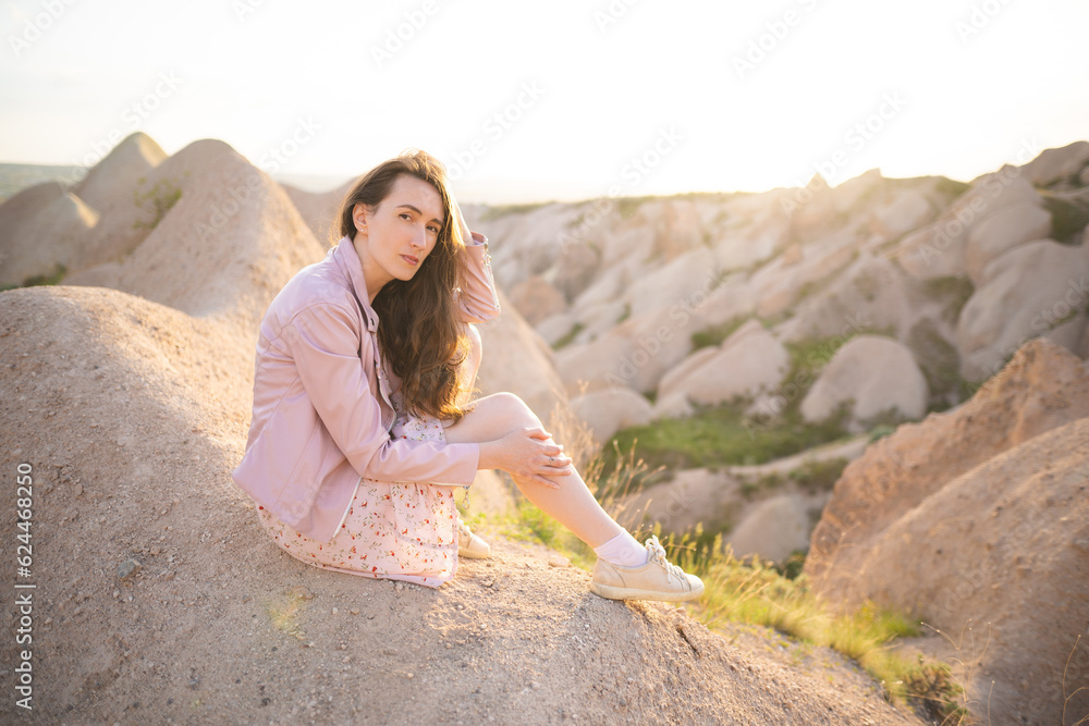 a beautiful girl walks on the top of the mountain enjoying the view a beautiful girl walks on the top of the mountain enjoying the view