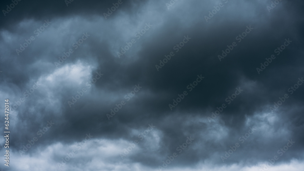 Overcast sky with dark clouds. Dark sky before a thunder-storm. The gray cloud background before rain. Overcast sky with dark clouds. Dark sky before a thunder-storm. The gray cloud background before rain.