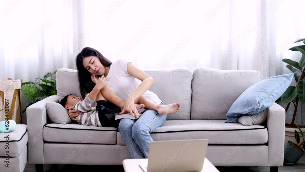 Lifestyle motherhood bonding relationship love and tenderness family concept, cute boy laughing playing with mother in living room at home, happy mom and adorable son cuddling and playing together Lifestyle motherhood bonding relationship love and tenderness family concept, cute boy laughing playing with mother in living room at home, happy mom and adorable son cuddling and playing together