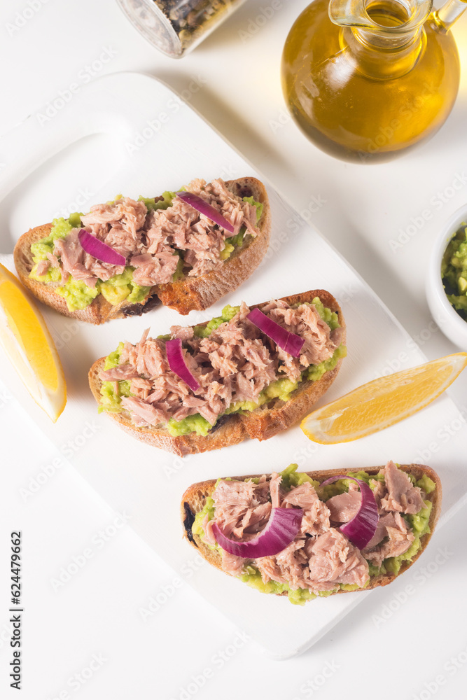 Toast with Canned Tuna. Fish open sandwich with red onion and lemon. Toast with Canned Tuna. Fish open sandwich with red onion and lemon.