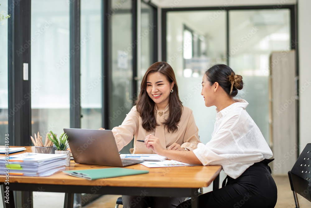 Two colleague businesswoman discussion and brainstorming business ideas. Consulting and marketing planning Two colleague businesswoman discussion and brainstorming business ideas. Consulting and marketing planning