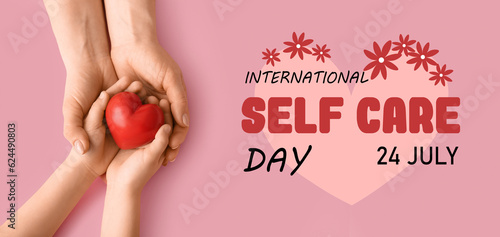 Banner for International Self Care Day with hands holding red heart