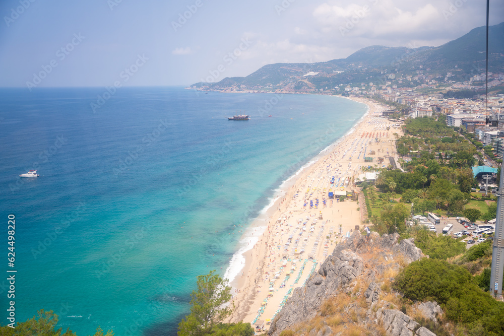 Fototapeta premium Aerial view of Cleopatra beach and Alanya from the cable car to Alanya castle, Turkey
