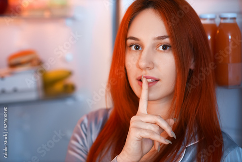 Young woman showing silence...