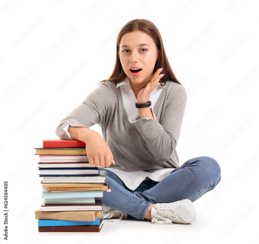 Female student with books sitting on white background Female student with books sitting on white background