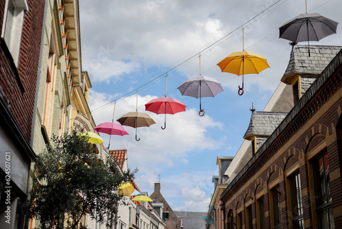 Colorful umbrellas hanging in the sky. Deventer  The Netherlands.