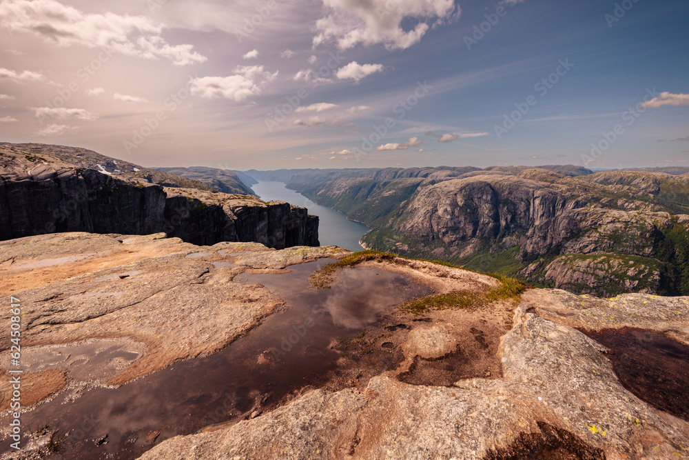 Kjerag, Norway - July 5th, 2023: The epic mountain landscape on the famous Kjerag hike in southern Norway Kjerag, Norway - July 5th, 2023: The epic mountain landscape on the famous Kjerag hike in southern Norway