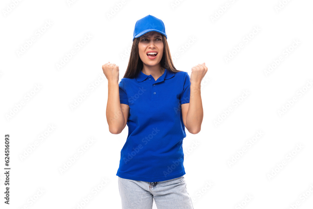 joyful pretty young brunette woman in blue cap and t-shirt with print mockup on white background with copy space joyful pretty young brunette woman in blue cap and t-shirt with print mockup on white background with copy space