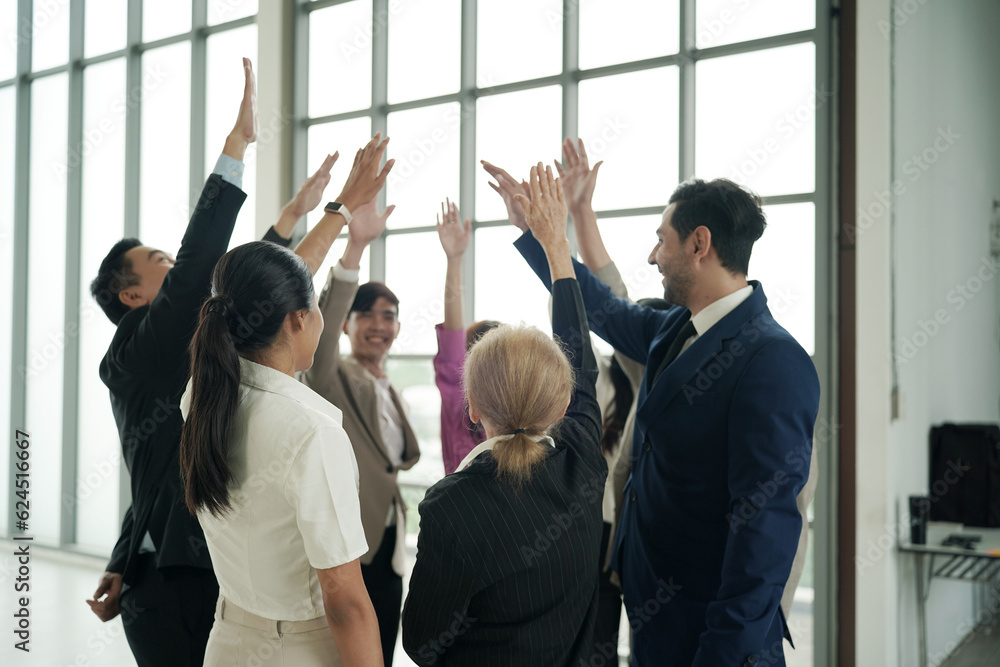 Obraz premium Business team stacking hands as symbol of unity