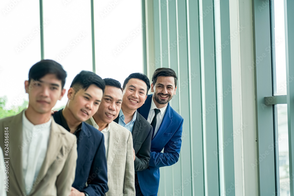 Business team stacking hands as symbol of unity Business team stacking hands as symbol of unity