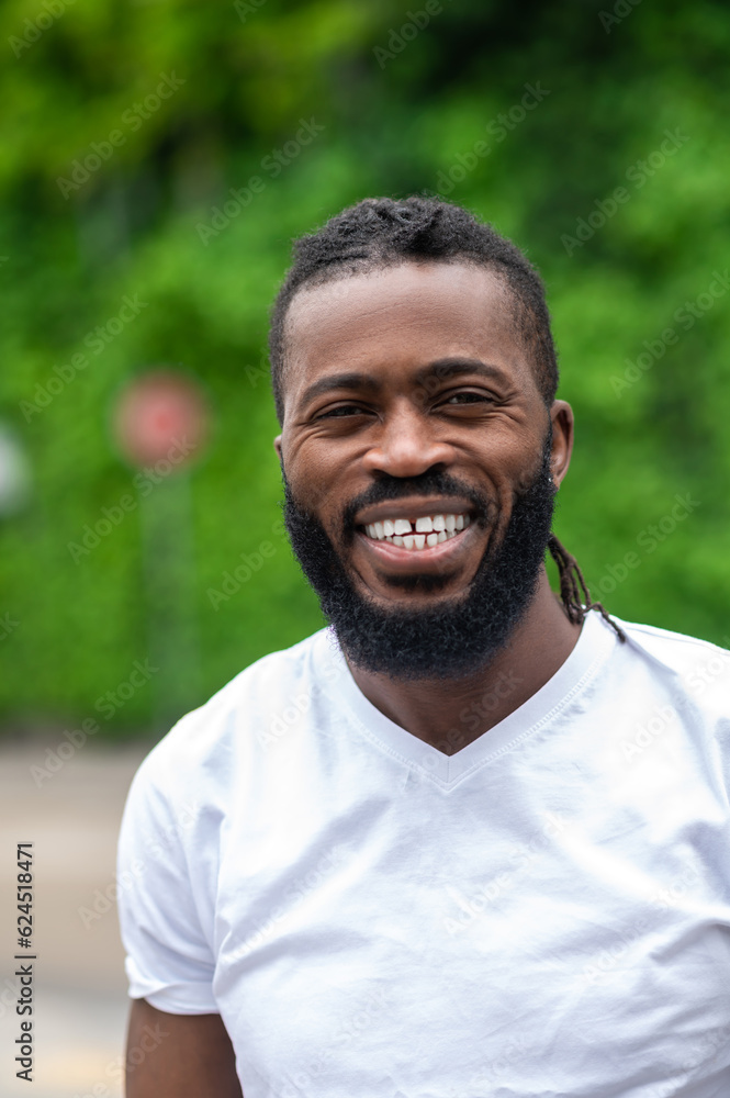 Portrait picture of a smiling dark-skinned handsome man Portrait picture of a smiling dark-skinned handsome man