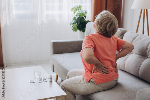 Tableau sur toile Senior lady feeling muscles pain attack, holding back, having problem with standing up